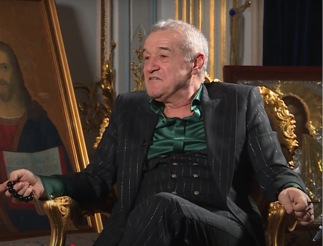 gigi becali in timpul unui interviu la el acasa, inconjurat de icoane