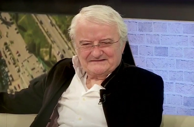 irinel columbeanu la o emisiune tv imbracat cu camasa alba si sacou negru