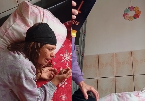 fetita din Dumbraveni Sibiu in timp ce este supusa unei sedinte de exorcizare de mama ei