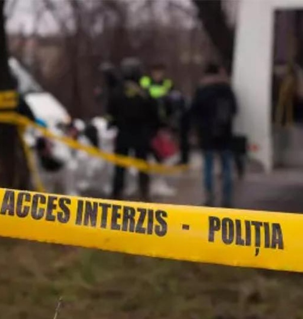 o banda galbena pe care scrie politia nu treceti care acopera o scena investigata de politisti