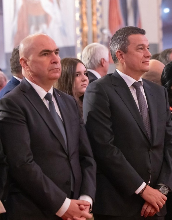 sorin grindeanu si ilie bolojan ambii imbracati in costum si cravata unul langa celalalt